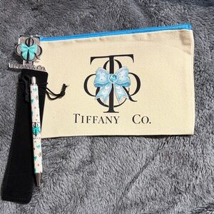 Canvas zipper pouch with matching zipper pull and matching pen with pen bag.